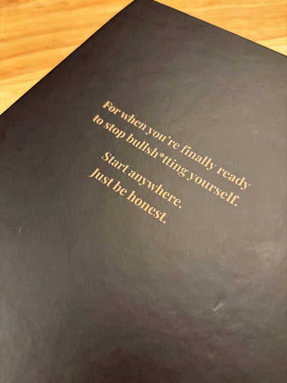 Real Growth journal interior showing 4-page structured prompt format with writing space